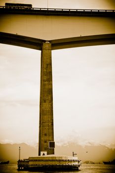 Sepia view of bridge over Guanbara Bay between Rio de Janeiro and Niteroi city, Brazil.