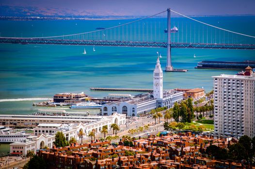 High angle view of Ferry Building on waterfront with Golden Gate bridge in background viewed from Coit Tower, San Francisco, California, U.S.A.