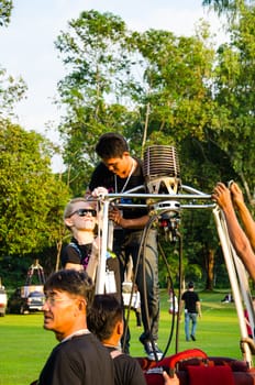 CHIANG MAI - DECEMBER 7: Unidentified pilot and team to prepare balloon on display at The Thailand International Balloon Festival 2013 on December 7, 2013 in Chiang Mai, Thailand.