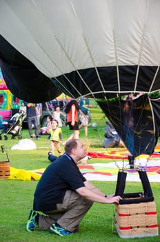 CHIANG MAI - DECEMBER 7: Unidentified pilot to prepare balloon on display at The Thailand International Balloon Festival 2013 on December 7, 2013 in Chiang Mai, Thailand.