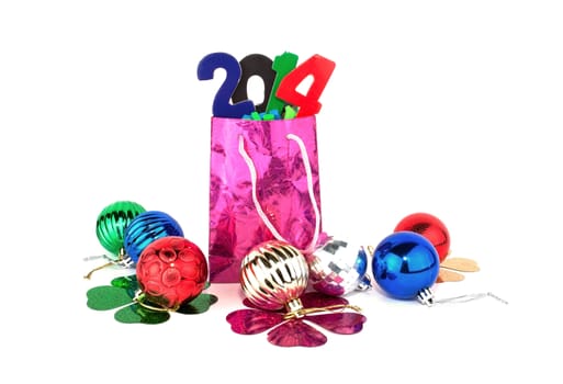 Gift bag with the number 2014 on the background of colorful Christmas balls