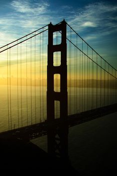 Silhouette of a suspension bridge at dawn, Golden Gate Bridge, San Francisco Bay, San Francisco, California, USA