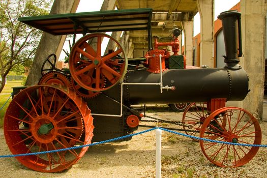 An antique steam tractor or traction engine.