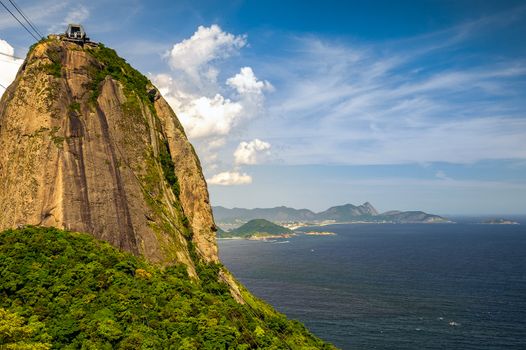 Overhead cable car approaching Sugarloaf Mountain, Guanabara Bay, Rio De Janeiro, Brazil