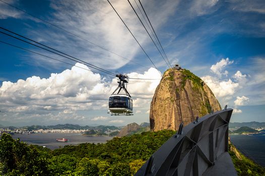 Overhead cable car approaching Sugarloaf Mountain, Guanabara Bay, Rio De Janeiro, Brazil