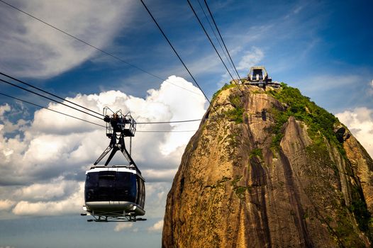 Overhead cable car approaching Sugarloaf Mountain, Guanabara Bay, Rio De Janeiro, Brazil