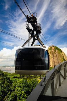 Overhead cable car approaching Sugarloaf Mountain, Guanabara Bay, Rio De Janeiro, Brazil