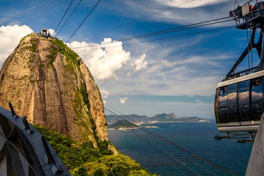 Overhead cable car approaching Sugarloaf Mountain, Guanabara Bay, Rio De Janeiro, Brazil