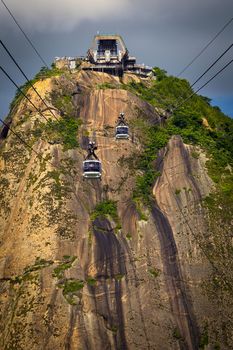 Overhead cable car approaching Sugarloaf Mountain, Guanabara Bay, Rio De Janeiro, Brazil