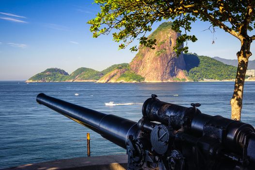 Cannon at the waterfront with Sugarloaf Mountain in the background, Guanabara Bay, Rio De Janeiro, Brazil