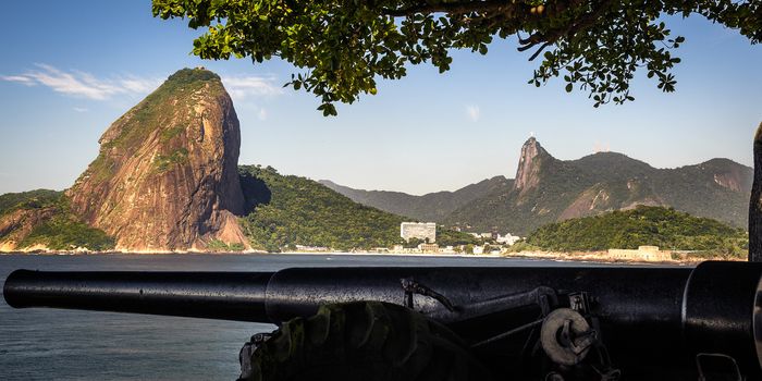 Cannon at the waterfront with Sugarloaf Mountain in the background, Guanabara Bay, Rio De Janeiro, Brazil