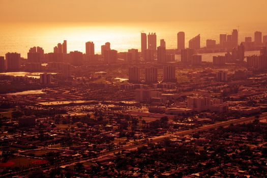 Aerial view of golden sunset over downtown Miami city, Florida, U.S.A.