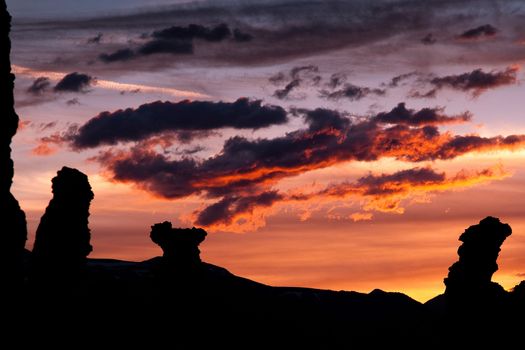 Dramatic sunset and cloudscape over silhouetted rock formations at Mono Lake neat Tioga Pass, Yosemite National Park, California, U.S.A.