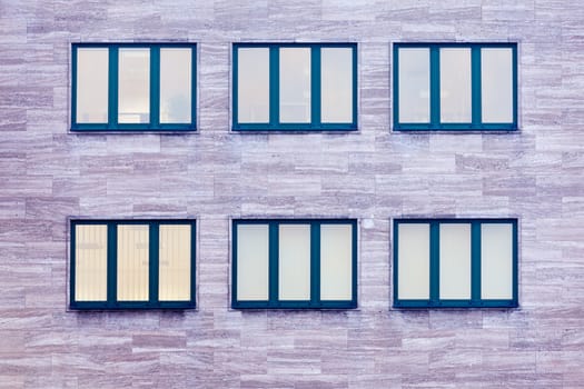 Group of windows in office building facade architectural background pattern abstract