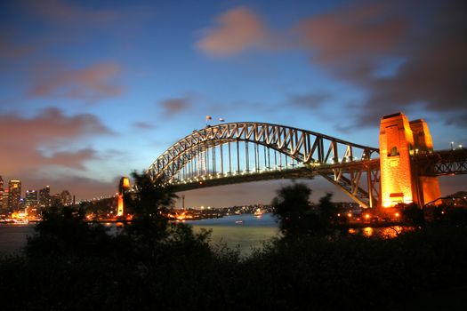 Sydney Harbour Bridge lit up at dusk, Sydney Harbor, Sydney, New South Wales, Australia