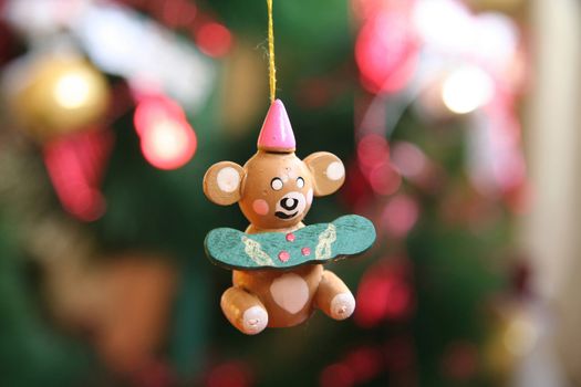 Small wooden teddy bear Christmas tree ornament.
