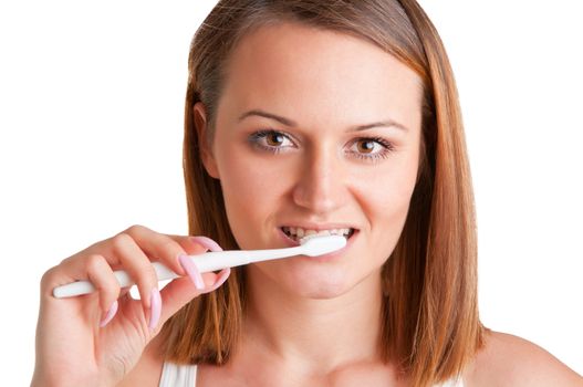 Closeup of young woman with a tooth brush on her hands, about to brush her teeth