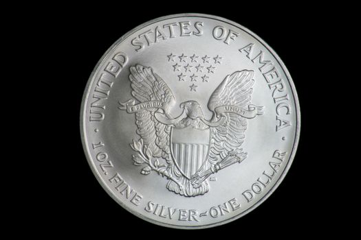 American Silver Eagle Dollar coin with Heraldic eagle with shield and thirteen five-pointed stars.