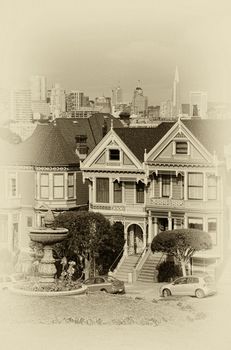 Victorian style houses on the Steiner Street with skylines in the background, Alamo Square Park, Alamo Square, San Francisco, California, USA