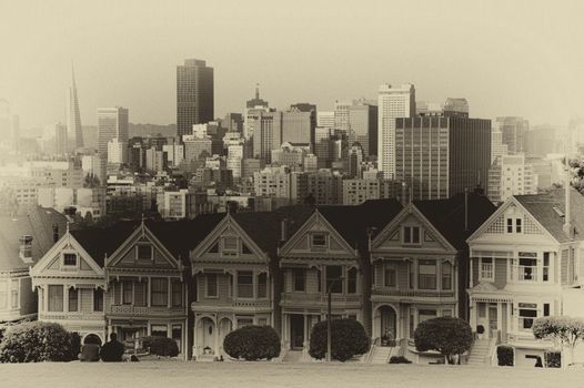 Victorian style houses on the Steiner Street with skylines in the background, Alamo Square Park, Alamo Square, San Francisco, California, USA