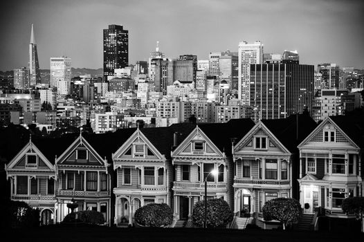 Victorian style houses on the Steiner Street with skylines in the background, Alamo Square Park, Alamo Square, San Francisco, California, USA