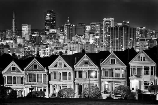 Victorian style houses on the Steiner Street with skylines in the background, Alamo Square Park, Alamo Square, San Francisco, California, USA