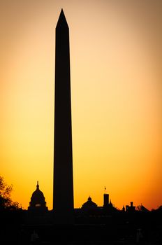 Silhouetted Capitol building and Washington Monument at sunset, Washington, D.C, U.S.A.