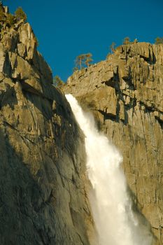 Water falling from rocks in a valley, Yosemite Falls, Yosemite Valley, Yosemite National Park, California, USA