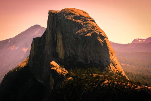 Mountains and forest pictured in sunset in Yosemite National Park, California, U.S.A.