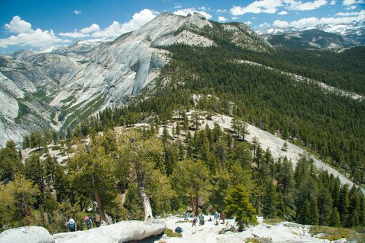 Scenic landscape of forest and mountain ranges viewed from Half Dome, Yosemite National Park, California, U.S.A.