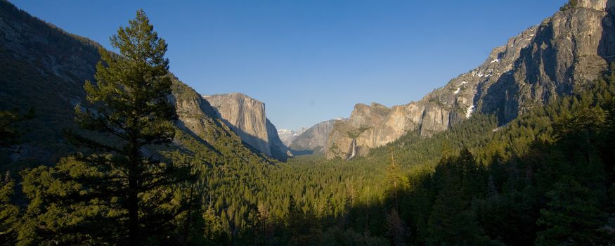 Rock formations in a valley, Bridal Veil Falls Yosemite, El Capitan, Half Dome, Yosemite Valley, Yosemite National Park, California, USA