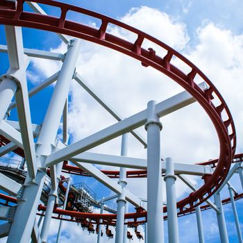 Rollercoaster ride with sky at theme park