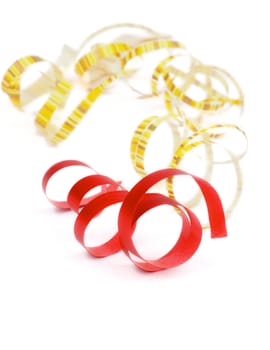 Curly Party Streamers Red and Yellow Striped Lying on white background