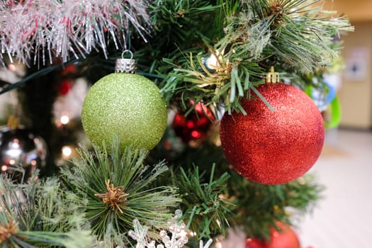 Christmas decorations and lights hanging on a Christmas tree