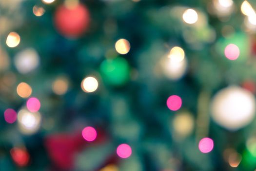 Abstract holiday background with blurred Christmas lights and festive bokeh