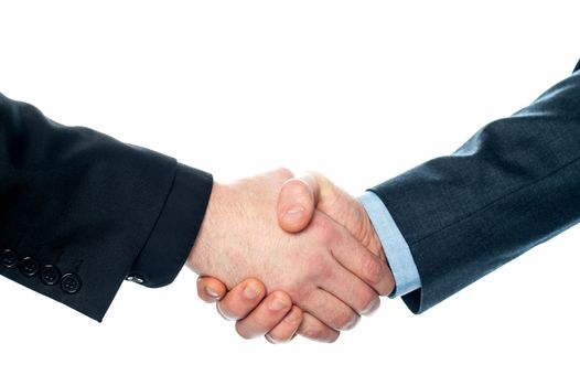 Handshake of business partners after striking deal