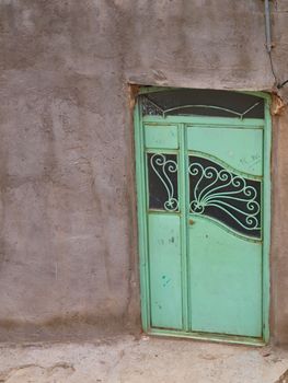 Green iron gate in Kandovan village in Tabriz, Iran