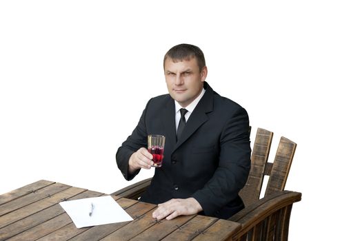 A man in a black suit holding a glass with Natural Supplements for athletes - dissolved in water, l-arginine, isolated on white background