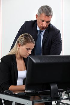 Boss explaining something to colleague