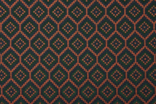 Material in geometric patterns, a colored textile background.