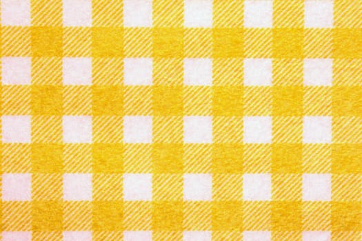 Material into yellow grid, a textile background background.