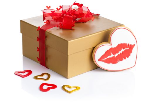 Valentine gift box and cookie in shape of heart with red lips on white background. Composition for Valentines Day