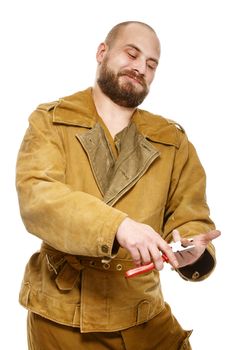 Bearded man with pliers. Concept: danger.