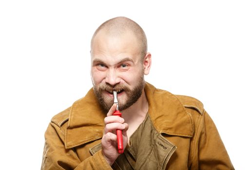 Bearded man pulls himself tooth with pliers. Isolate. White background.