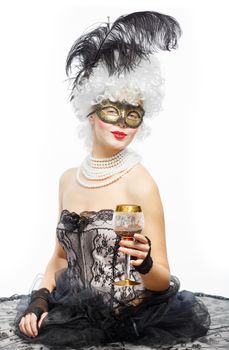 Masquerade in Venice. Princess in a black dress with a glass of wine.