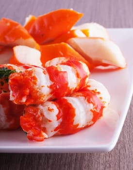 Shrimps in close up over a white plate