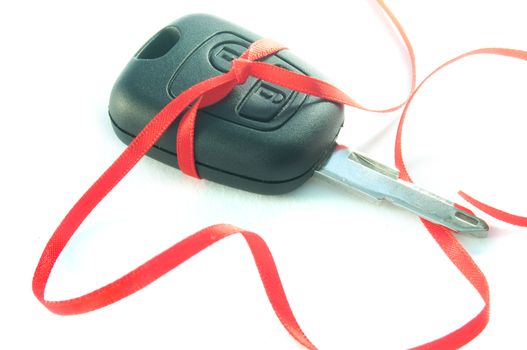 Gift ribbon tied around a set of car keys 