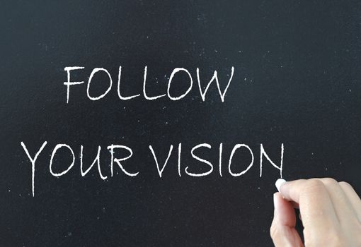 Follow your vision handwritten on a chalkboard
