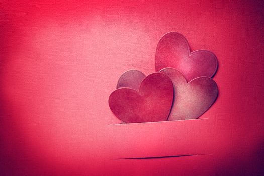 Handmade paper craft Valentine hearts in magenta color