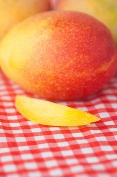 mango fruit on checkered fabric